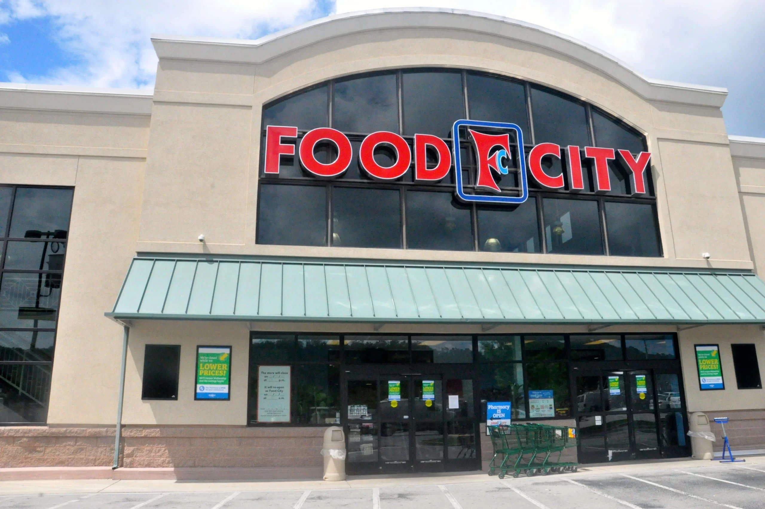 Outside of a Food City store with the store logo in large red letters