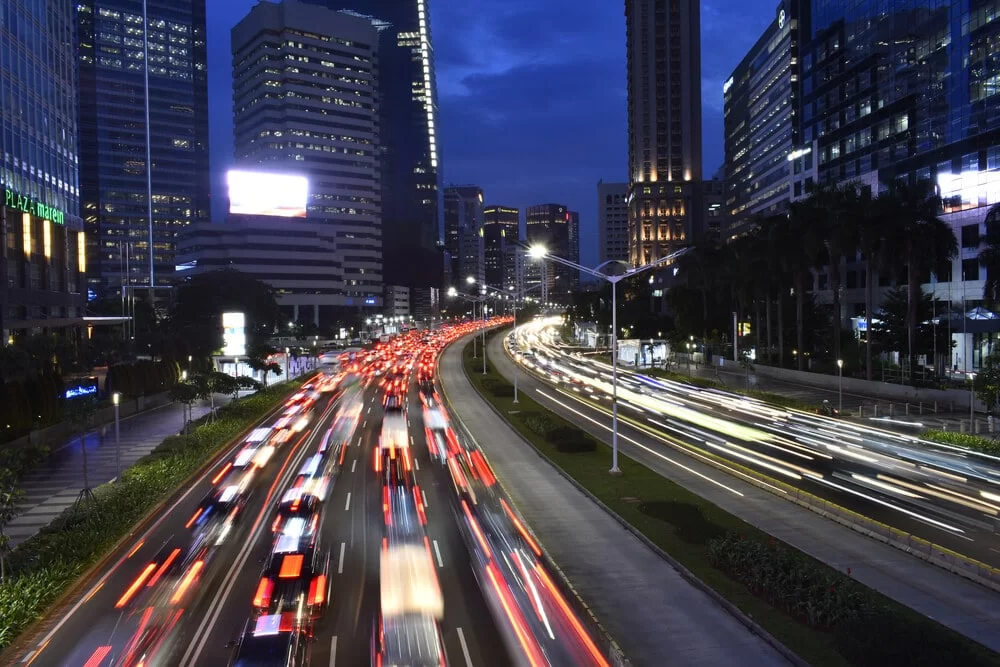cars on a city highway at night