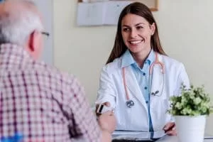 Medical professional taking a credit card payment from a patient
