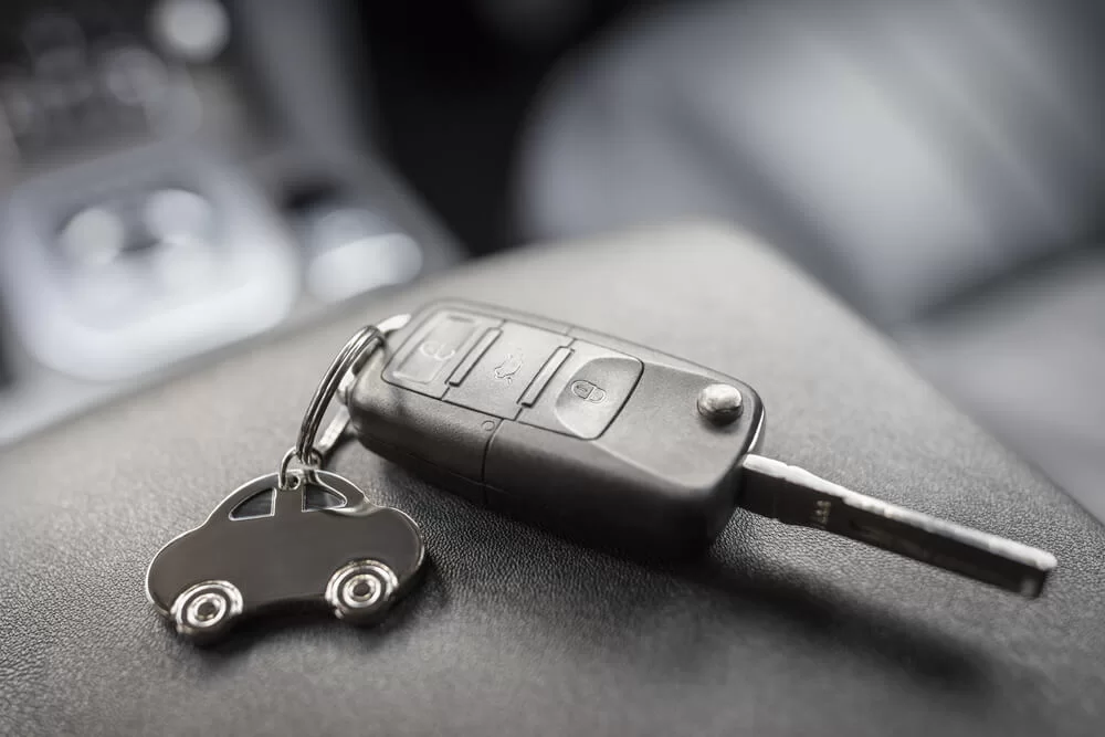 Rental car key on a car-shaped keychain