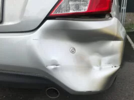Dented fender of a car after a minor accident