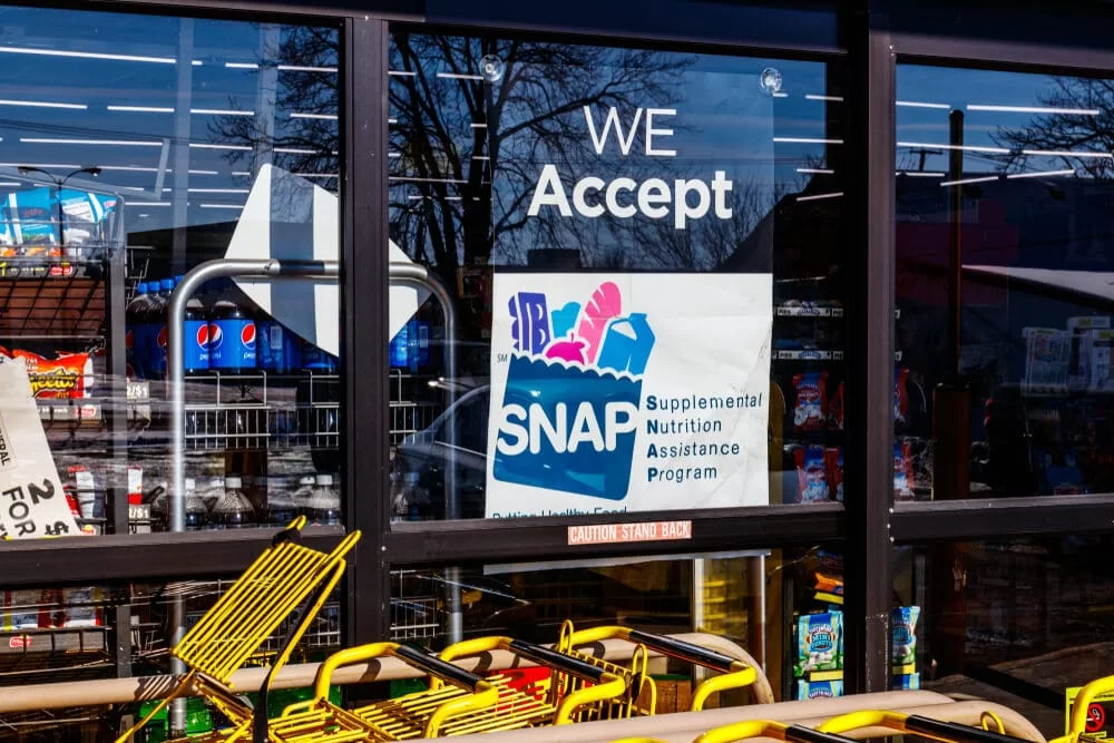SNAP sign in a store window