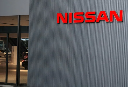 Nissan logo sign on the outside of a dealership