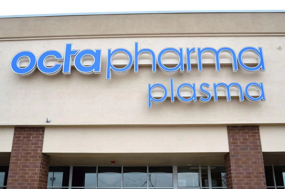 Sign above the entrance to an Octapharma Plasma donation center