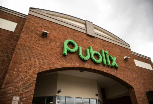 Green logo sign on the exterior of a Publix store