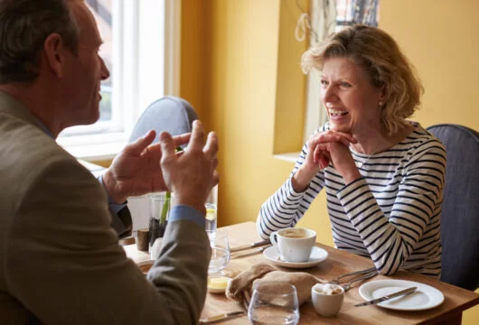 Couple dining at a restaurant with a senior discount