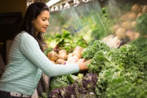 Woman grocery shopping at a store that accepts EBT