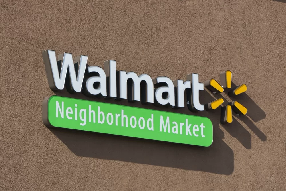 Logo sign on the outside of a Walmart Neighborhood Market store
