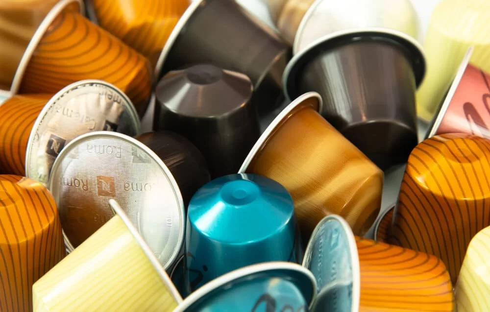 Large pile of assorted Nespresso pods or capsules