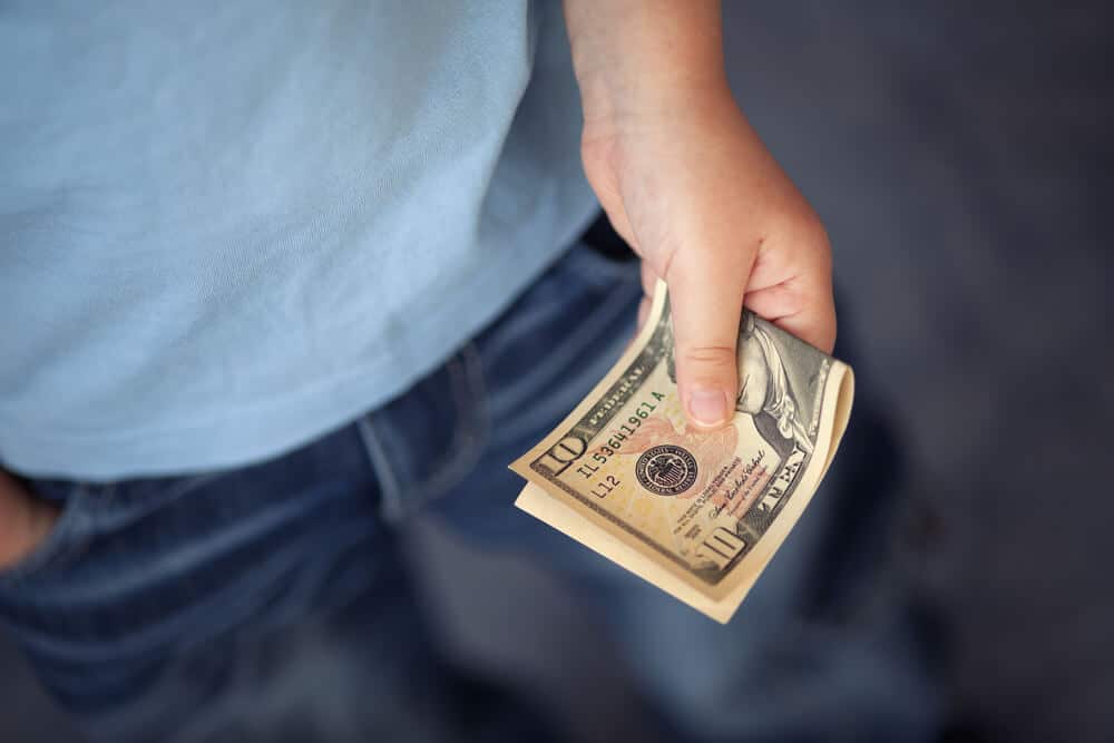 Man holding a $10 bill