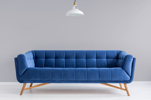 Blue rent-to-own couch from a store like Aaron's