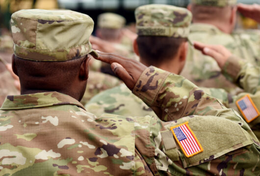 Active-duty military doing a salute while in uniform