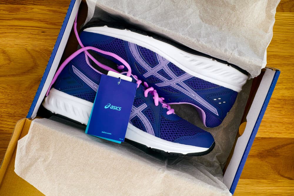 New blue and purple running shoes in the box
