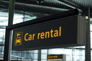 "Car rental" sign at an airport
