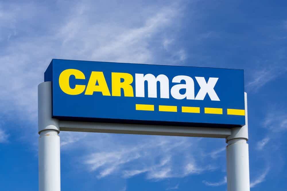 CarMax sign with sky in the background