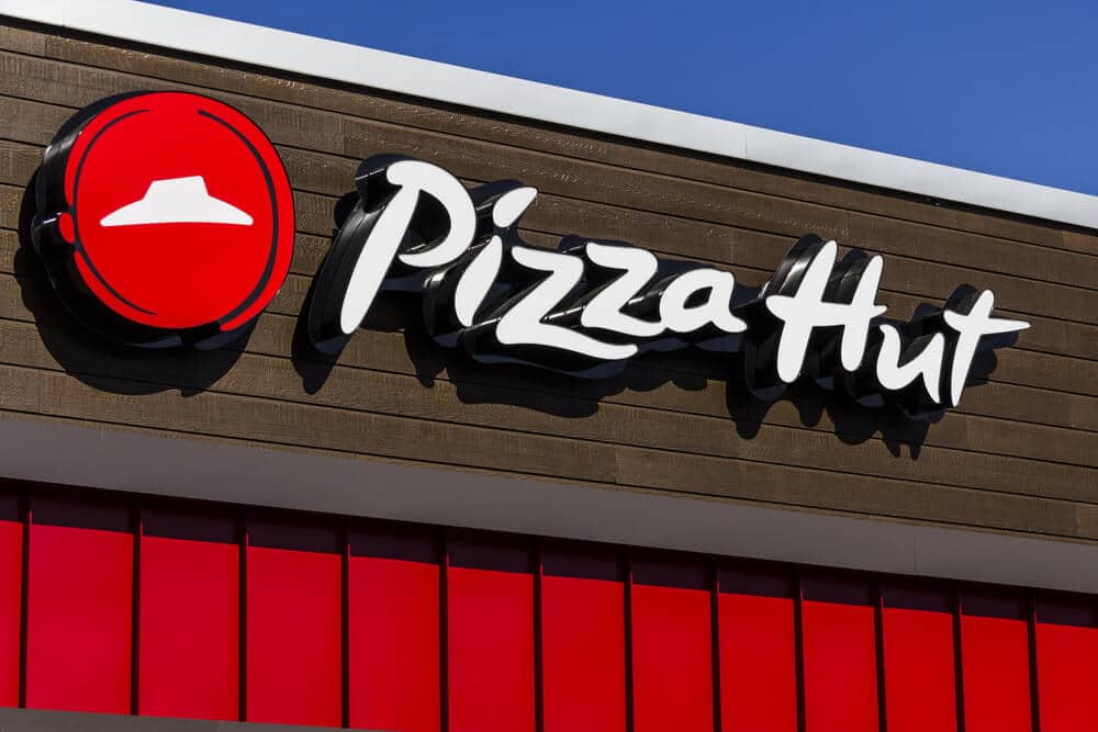 Pizza Hut logo sign on the outside of a restaurant