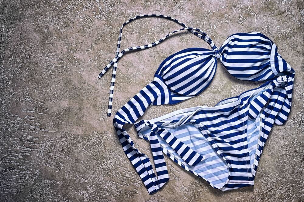 A navy blue and white striped bathing suit that someone is ready to sell.