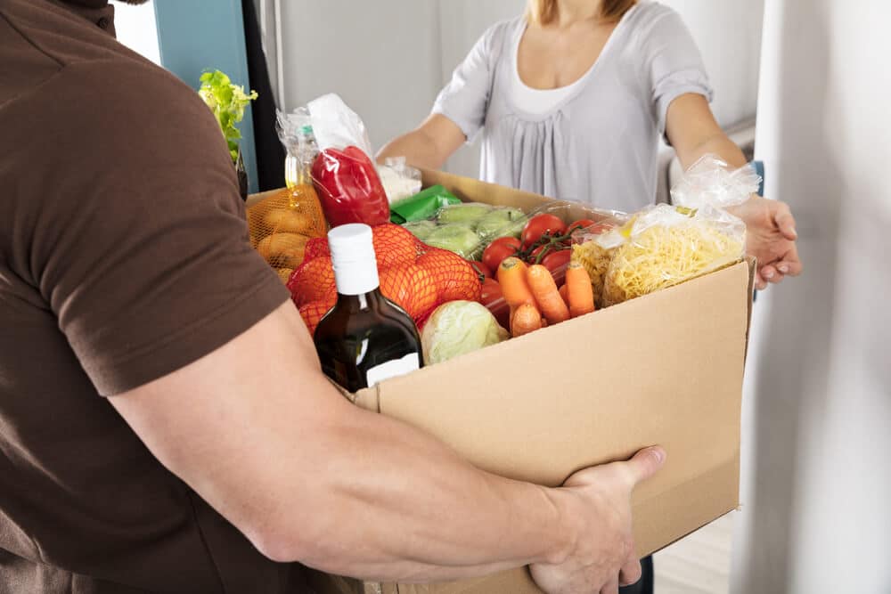 Man delivers groceries to EBT recipient.