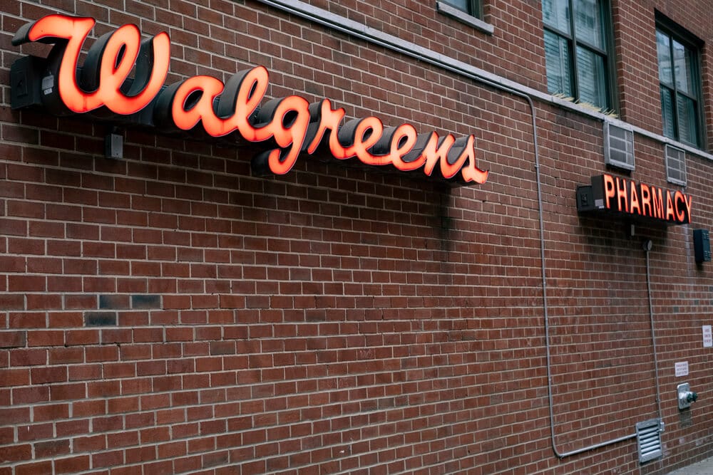 Walgreens sign on the exterior brick wall of a store