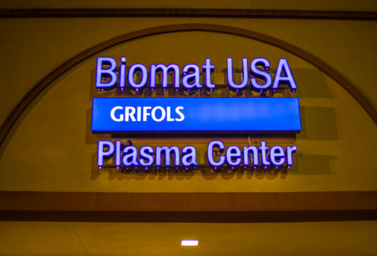 Sign for Biomat USA, a Grifols Plasma donation center that pays for plasma