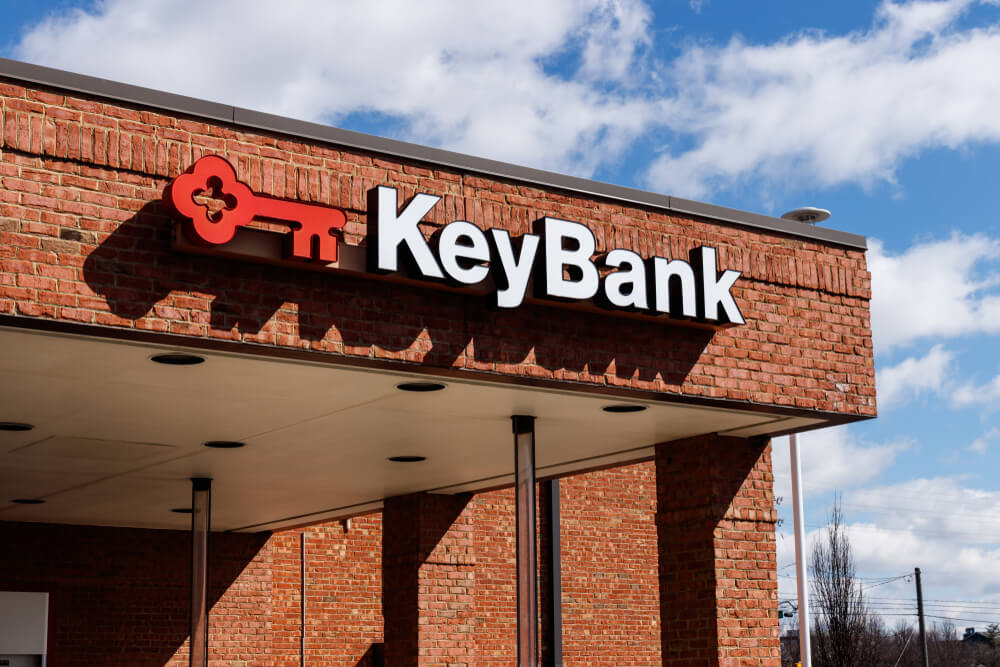 KeyBank's red and white key logo on the outside of a branch building
