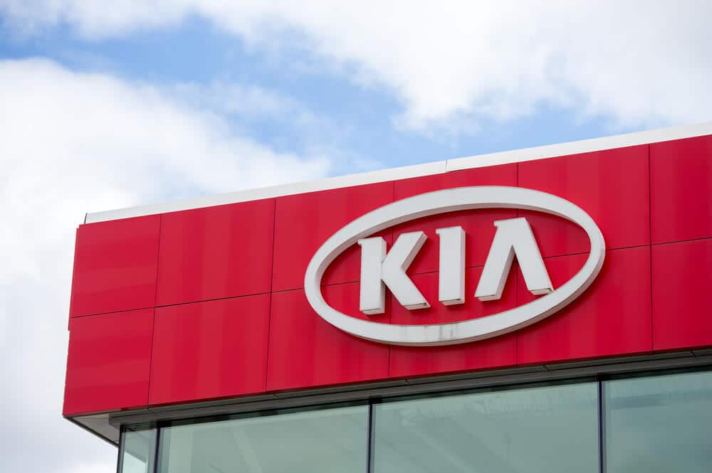 Kia logo sign on the outside of a dealership