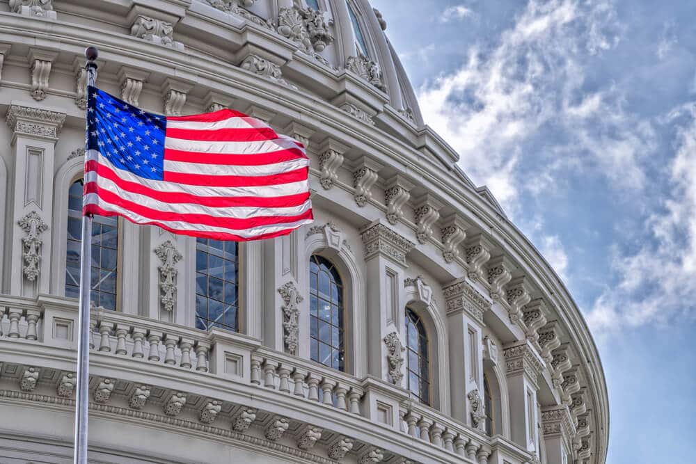 American flag flying outside of a government building