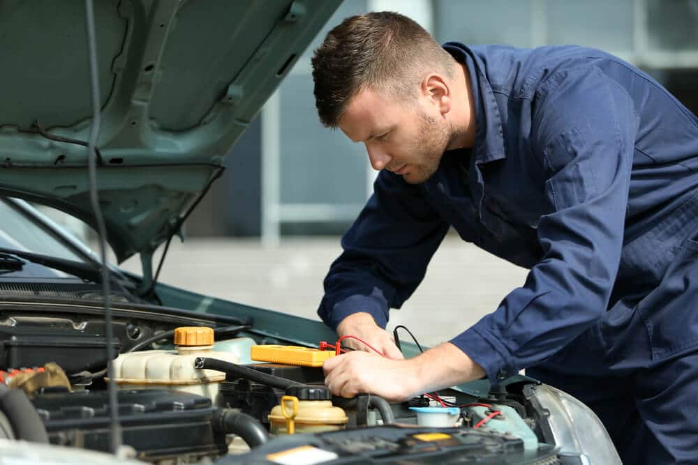 Mechanic fixing a car without permission