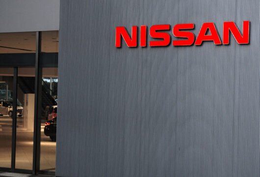 Nissan logo sign on the outside of a dealership
