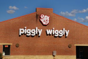 Logo sign above the front entrance of a Piggly Wiggly store