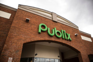 Green logo sign on the exterior of a Publix store