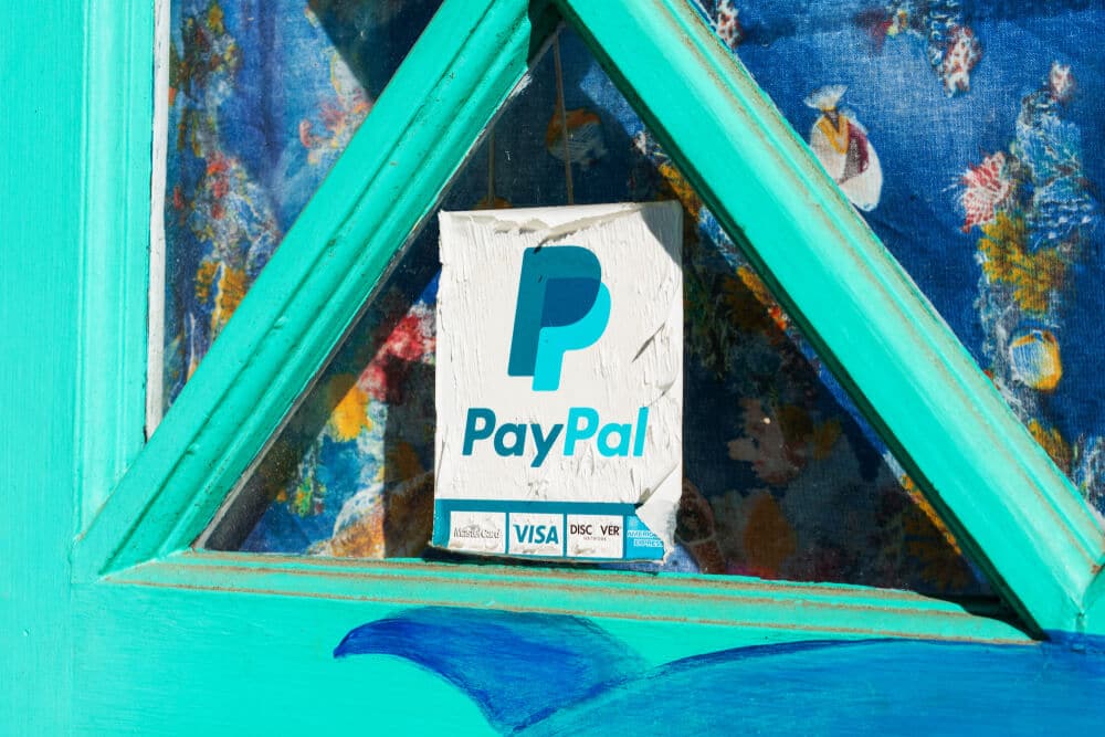 PayPal acceptance sign on the window of a restaurant