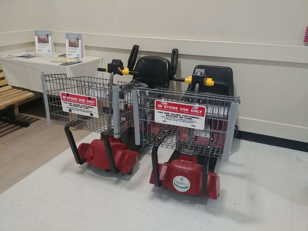 Motorized shopping cars in a grocery store.