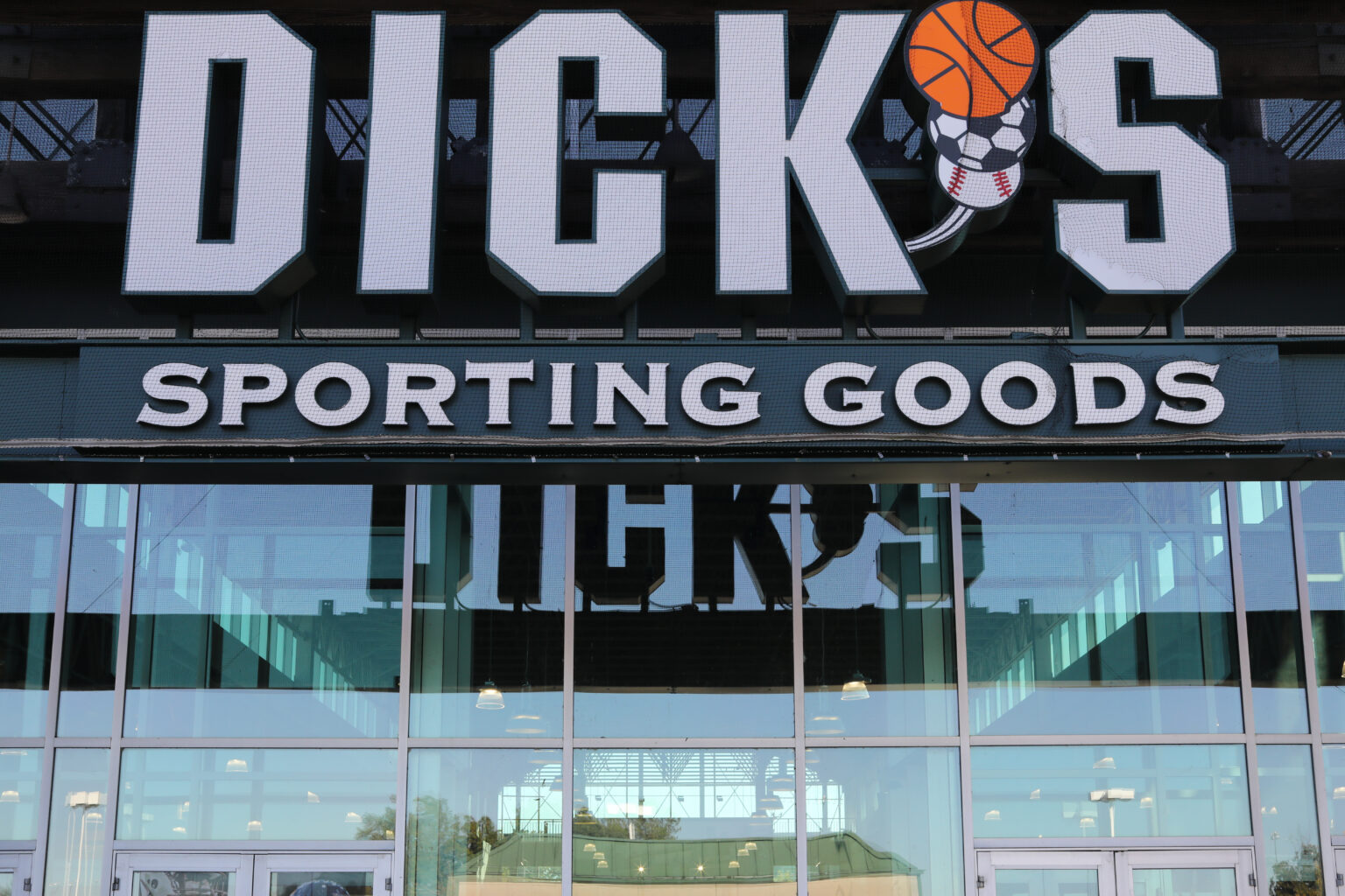 Logo sign above the entrance of a DICK'S Sporting Goods store