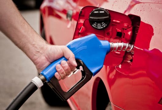 Close-up of man's hand pumping gas