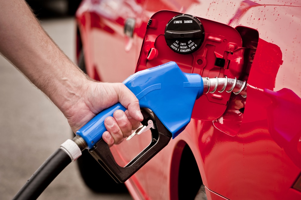 Close-up of man's hand pumping gas