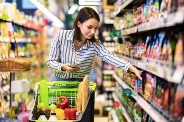 Woman grocery shopping at a store that accepts start checks