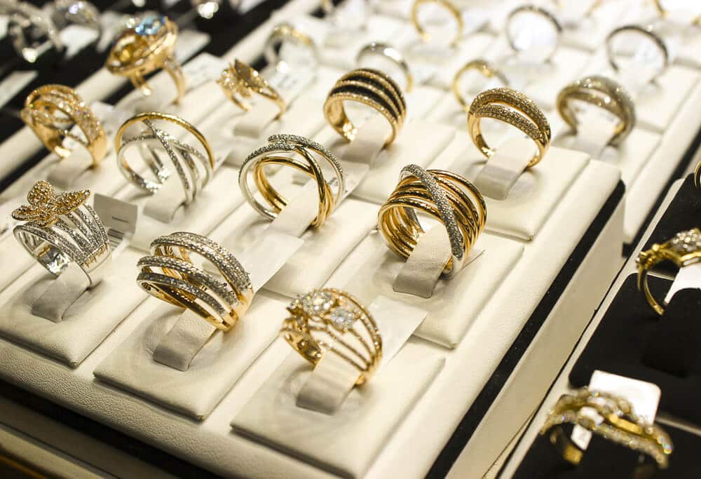 jewelry display case with gold rings