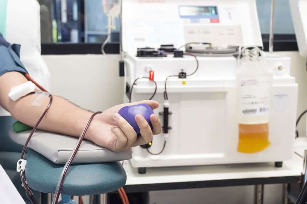 Close-up of man's arm donating plasma
