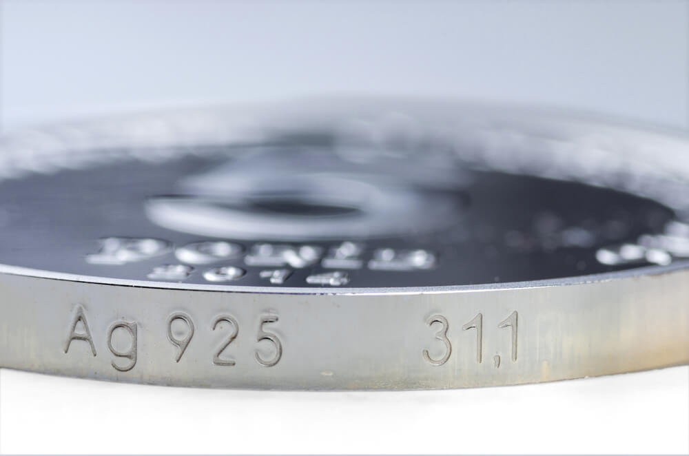 a silver coin stamped with 925